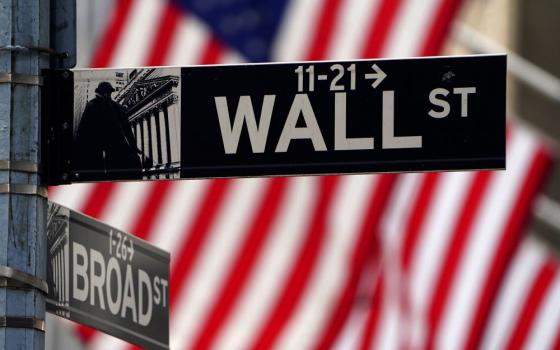 Wall Street sign is pictured outside the New York Stock Exchange in New York City April 16, 2021. (OSV News/Reuters/Carlo Allegri)