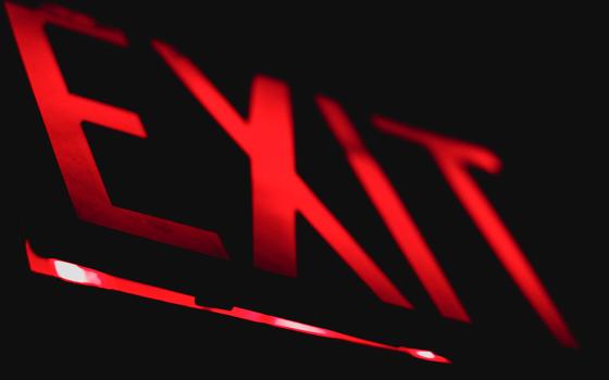 Red lighted exit sign (Unsplash/Wes Branch)