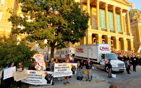 The Occupy the World Food Prize group protests within sight and sound of the Iowa Capitol building during the presentation of the World Food Prize on Oct. 19 in Des Moines. (Aaron Jorgensen-Briggs)