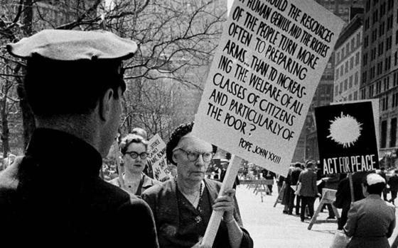 Dorothy Day pickets a civil defense drill in New York City April 17, 1959. (Journey Films/©Vivian Cherry)