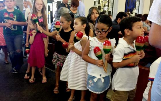 A Mass at St. Mark Church in El Paso, Texas, begins with children leading the procession with maracas. (NCR photo/Soli Salgado)