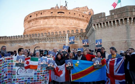 Clerical sex abuse survivors and their supporters rally outside Castel Sant'Angelo in Rome in this Feb. 21, 2019, file photo. The rally took place during a three-day meeting of 130 heads of bishops' conferences. 