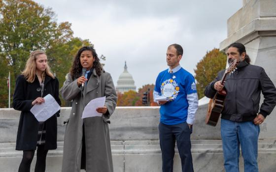 Trinity Cooper and Abigail Gonzales from Bishop O'Dowd High School in Oakland, Ca. speak on environmental justice on Capitol Hill. (Photo by Kelly Swan/Ignatian Solidarity Network)