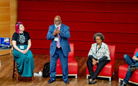 Jerry Givens speaks during a panel on "Leaving Violent Institutions" at the Rehumanize conference at Loyola University New Orleans Oct. 19. (Grace Sommerville)