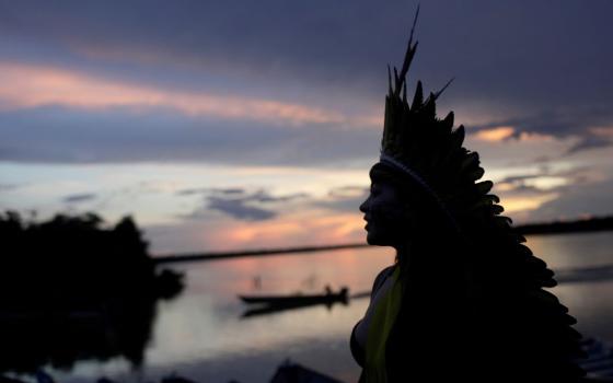 A leader of the Celia Xakriaba peoples walks along the banks of the Xingu River in Brazil's Xingu Indigenous Park Jan. 15, 2020. 