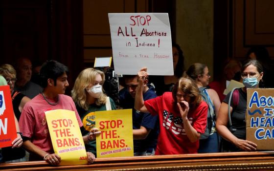 Activists protest inside the Indiana Statehouse in Indianapolis July 25 during a special session debate on banning abortion. (CNS/Reuters/Cheney Orr)