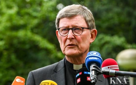 German Cardinal Rainer Maria Woelki speaks during a Sept. 24 news conference in Cologne. Pope Francis has refused his resignation but granted him a six-month period of spiritual reflection. (CNS/KNA/Harald Oppitz) 