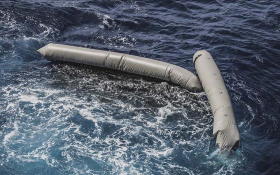 Debris from a dinghy that was supposedly carrying an estimated 130 migrants floats in the Mediterranean Sea northeast of the Libyan capital, Tripoli, April 22. (SOS Mediterranée via AP/Flavio Gasperini)