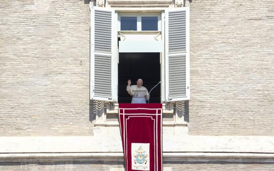 Pope Francis delivers his blessing as he recites the Angelus noon prayer from the window of his studio overlooking St.Peter's Square, at the Vatican, Sunday, Sept. 5, 2021. (AP Photo/Andrew Medichini)