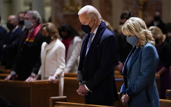 On Jan. 20, then-President-elect Joe Biden and his wife, Jill Biden, attend Mass at the Cathedral of St. Matthew the Apostle during Inauguration Day ceremonies in Washington. (AP Photo/Evan Vucci)