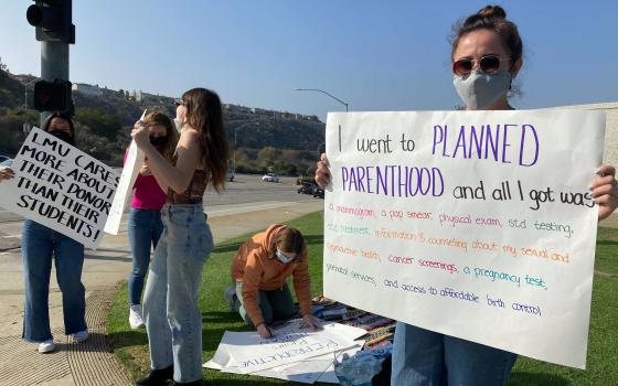 Nicole Baxley, right, a senior at Loyola Marymount University, organized a protest Wednesday, Nov. 17, 2021. (RNS photo by Alejandra Molina)