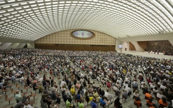 People listen to Pope Francis during his weekly general audience in Paul VI hall Sept. 8 at the Vatican. (AP/Andrew Medichini)