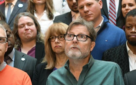 Brian Toale speaks while standing with New York legislators, survivors and advocates in favor of the Child Victims Act at the state Capitol in Albany Jan. 28. (AP Photo/Hans Pennink)