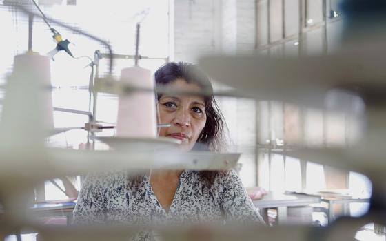 A worker sews Fashion Nova clothing in a garment factory in downtown Los Angeles on April 1, 2019. (AP/GDA via AP Images/The New York Times/Jessica Pons)