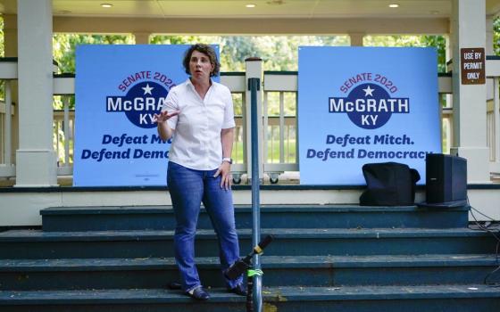 U.S. Senate candidate Amy McGrath rallies with supporters during a campaign stop at Woodland Park in Lexington, Kentucky, Aug. 25. (AP Photo/Bryan Woolston)