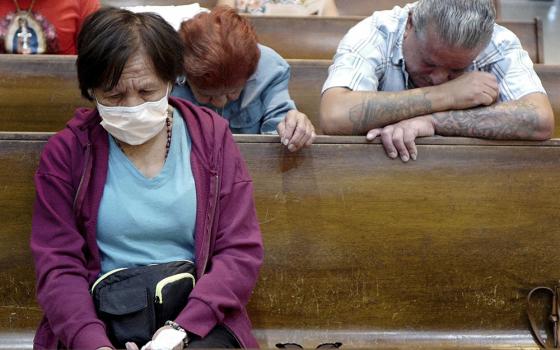 Esperanza Treviño, mother of Melissa Lucio, bows her head during a vigil at the Basilica of Our Lady of San Juan del Valle National Shrine April 22 in San Juan, Texas. On April 25, the Texas Court of Criminal Appeals stayed Lucio's execution.