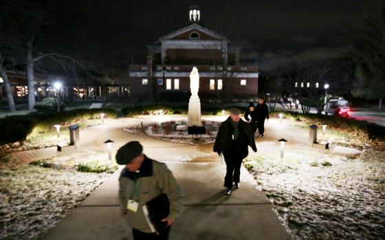 Bishops walk on the grounds of Mundelein Seminary Jan. 2 at the University of St. Mary of the Lake in Illinois, near Chicago. The U.S. bishops began their Jan. 2-8 retreat at the seminary. (CNS/Bob Roller)