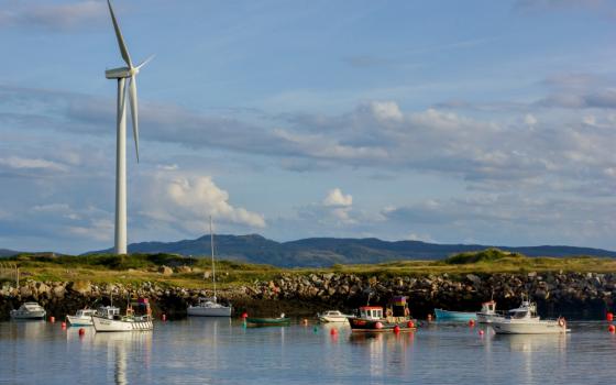 A wind turbine stands over in Burtonport, County Donegal, Ireland, in 2014. (Wikimedia Commons/Jakub Michankow)