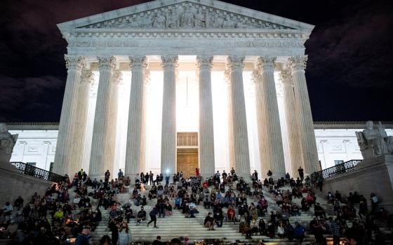 People in Washington gather in front of the U.S. Supreme Court following the death of Supreme Court Justice Ruth Bader Ginsburg, 87, Sept. 18. (CNS/Reuters/Al Drago)