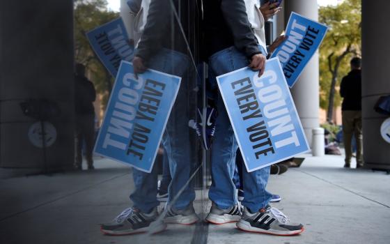 People in Houston gather to protest outside of a federal courthouse Nov. 2, where a judge rejected a GOP bid to throw out ballots cast at drive-through polling locations. (CNS/Reuters/Callaghan O'Hare)