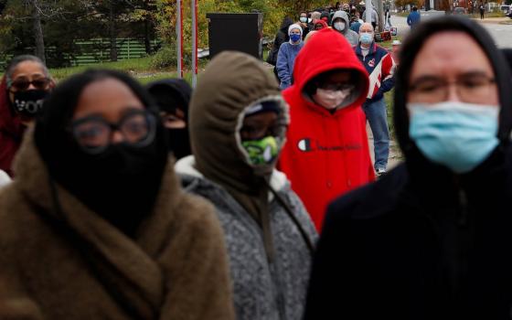 People in Cleveland wait in line to cast early in-person votes Oct. 24. (CNS/Reuters/Shannon Stapleton)