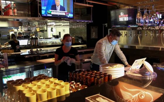 People in Miami work at a restaurant Aug. 31, 2020, during the coronavirus pandemic. (CNS/Reuters/Marco Bello)