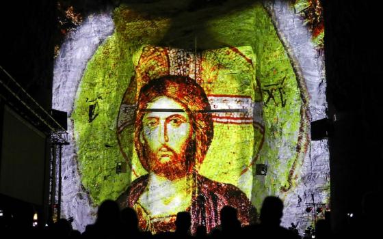 An image of Christ is projected during a ceremony to celebrate 25 years of the Salt Cathedral of Zipaquira in Colombia Dec. 16. (CNS/Reuters/Luisa Gonzalez)