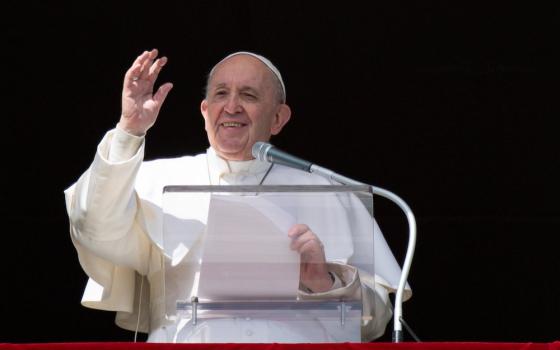 Pope Francis greets the crowd as he leads the Angelus from the window of his studio overlooking St. Peter's Square at the Vatican Feb. 28, 2021. (CNS/Vatican Media)