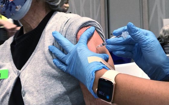 Susan Lavin, a member of The Madeleine Parish in Portland, Oregon, receives a COVID-19 vaccine at the Oregon Convention Center Feb. 24, 2021. (CNS/Catholic Sentinel/Courtesy of Susan Lavin)