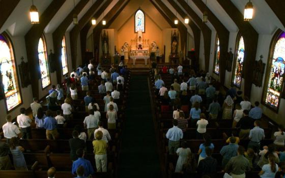 People attend Mass at Christendom College in 2003. (Newscom)