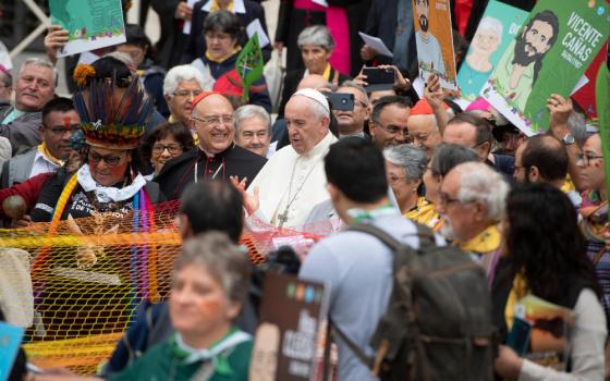 Pope Francis and Peruvian Cardinal Pedro Barreto Jimeno join a procession before the first session of the Synod for the Amazon on Oct. 7, 2019. (CNS photo/Vatican Media)