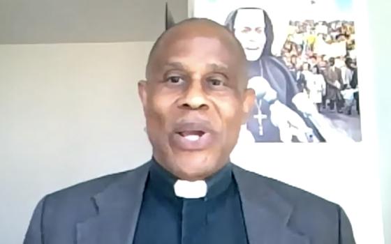 Fr. Bryan Massingale accepts Pax Christi USA's "Teacher of Peace" award July 31 during the organization's national conference, held via Zoom. (NCR screenshot)