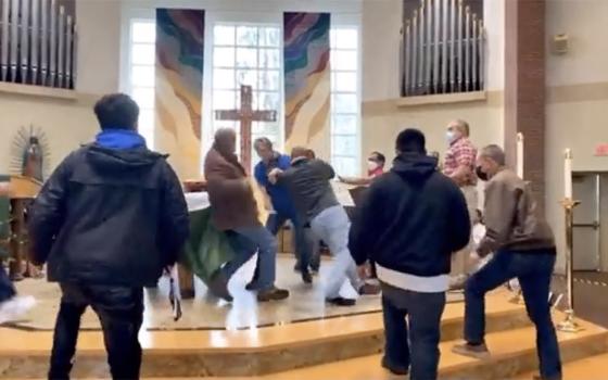 A screenshot of a video on Twitter of a confrontation at Mass Oct. 24 at St. Frances Cabrini Church in Lakewood, Washington (NCR screenshot)