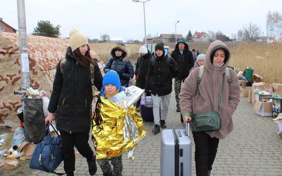 Ukrainian refugees after crossing the Ukrainian-Polish border near Przemyśl, Poland (NCR photo/Chris Herlinger)