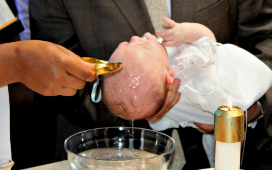 The baptism of George DeSales Piper on Oct. 1 at St. Barnabas Parish in Chicago (Provided photo)