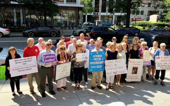 Protesters, including survivors of clergy sex abuse, stand outside the Cathedral of St. Matthew the Apostle in Washington, D.C., Aug. 26. (Julie Bourbon)