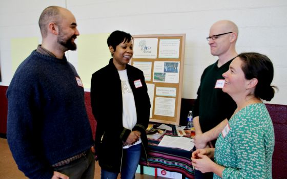 From left: Zachary Johnson, executive director of Call to Action; Crystal King, director of administration of Call to Action; and Steve and Laura Brown of Casa Alma, the Catholic Worker community in Charlottesville (James C. Webster)