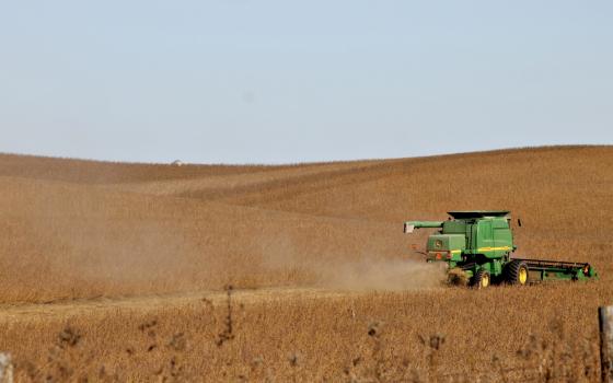 A combine harvests a soybean field Oct. 18 outside Dyersville, Iowa. Soybeans are one of the commodities hit with a tariff from China as part of its ongoing trade dispute with the U.S. (NCR photo/Brian Roewe)