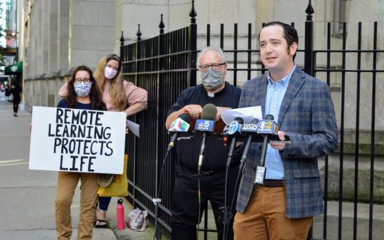 James Cahill, 32, a middle school social studies teacher at St. Francis Xavier School in Wilmette, Illinois, speaks out against the Chicago Archdiocese's reopening plan at a rally in front of schools' headquarters in downtown Chicago on Aug. 20. (Courtesy