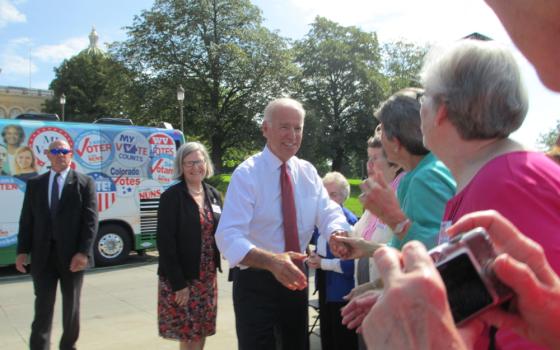 Vice President Joe Biden greets Catholic sisters who were kicking off Network's Nuns on the Bus tour Sept. 17, 2014, in Des Moines, Iowa. Social Service Sr. Simone Campbell, executive director of Network Catholic Social Justice Lobby, is at left behind hi