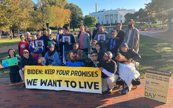 Participants in the All Saints' Day solidarity fast organized by Catholic Climate Covenant and the Ignatian Solidarity Network visit climate hunger strikers outside the White House in Washington, D.C. (Courtesy of Josh Burg)