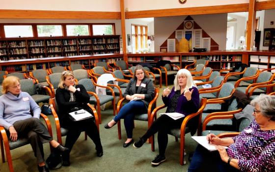 Members of Catholics for Change in Our Church take part in a small-group discussion during the January meeting of the group, which advocates for reform in the Pittsburgh Diocese. (Kevin Hayes)