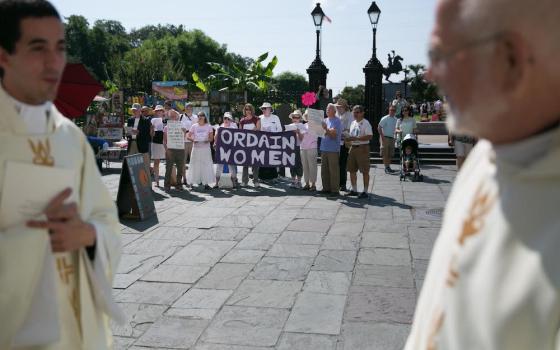 Supporters of women's ordination gather in Jackson Square in New Orleans outside the St. Louis Cathedral during the archdiocese's ordination ceremony for new priests in June 2015. (Gabriela Arp)