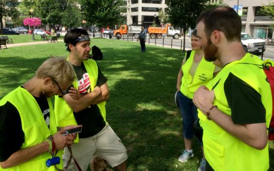 Trained unarmed protectors attend the Unite the Right rally in Washington, D.C., Aug. 12 to accompany counterprotesters and de-escalate violent situations. (Heidi Thompson)