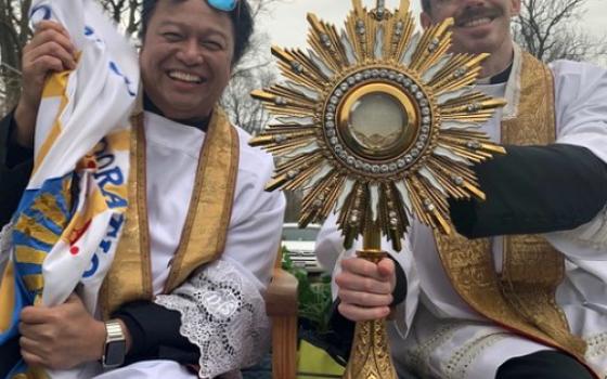 Fr. Santos "Sunny" Castillo, left, and parochial vicar Fr. John Horan of St. John Paul II Catholic Parish in Kankakee, Illinois, drive around parishioners' neighborhoods on Easter morning April 12. (Courtesy of Fr. Santos Castillo)