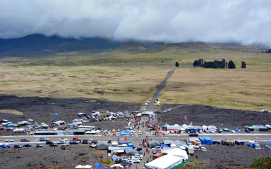 Activists — who prefer the term "protectors" — camp near an access road to Mauna Kea in Hawaii to protest a planned telescope atop the mountain. (RNS/Jack Jenkins)