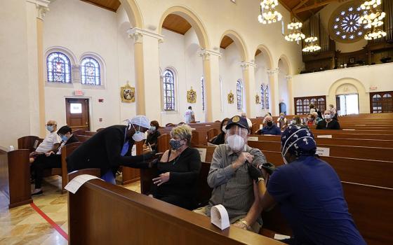 Diane and Jack Leahy of Miami Lakes, Florida, receive the second dose of the Moderna COVID-19 vaccine at St. Patrick Catholic Church March 1, 2021, in Miami Beach.