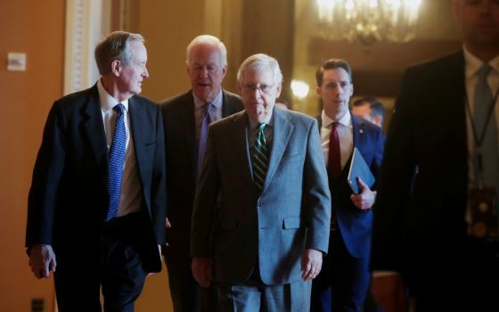 Senate Majority Leader Mitch McConnell, R-Kentucky, center, is seen with fellow Republican senators Jan. 16 at the U.S. Capitol in Washington. (CNS/Reuters/Jonathan Ernst)