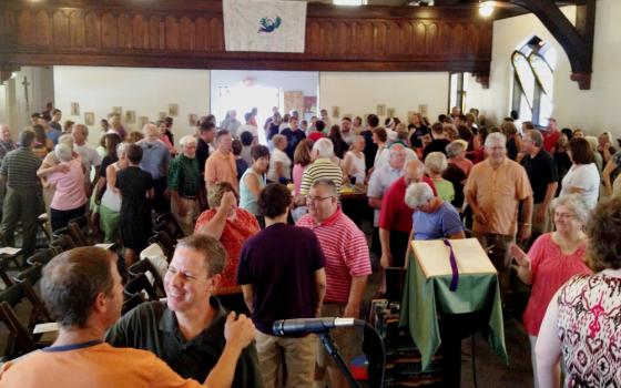 Parishioners of St. William Catholic Community in Louisville, Kentucky, share the sign of peace at a recent Mass. (Courtesy of St. William Catholic Community)