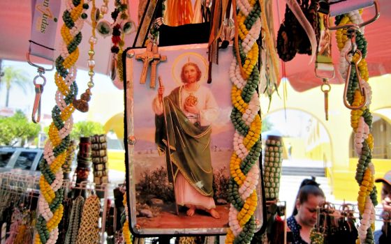 Merchants bring St. Jude Thaddeus imagery from Mexico City to sell outside of the iconic church named for him in Guadalajara, Mexico. (Stephen Woodman)